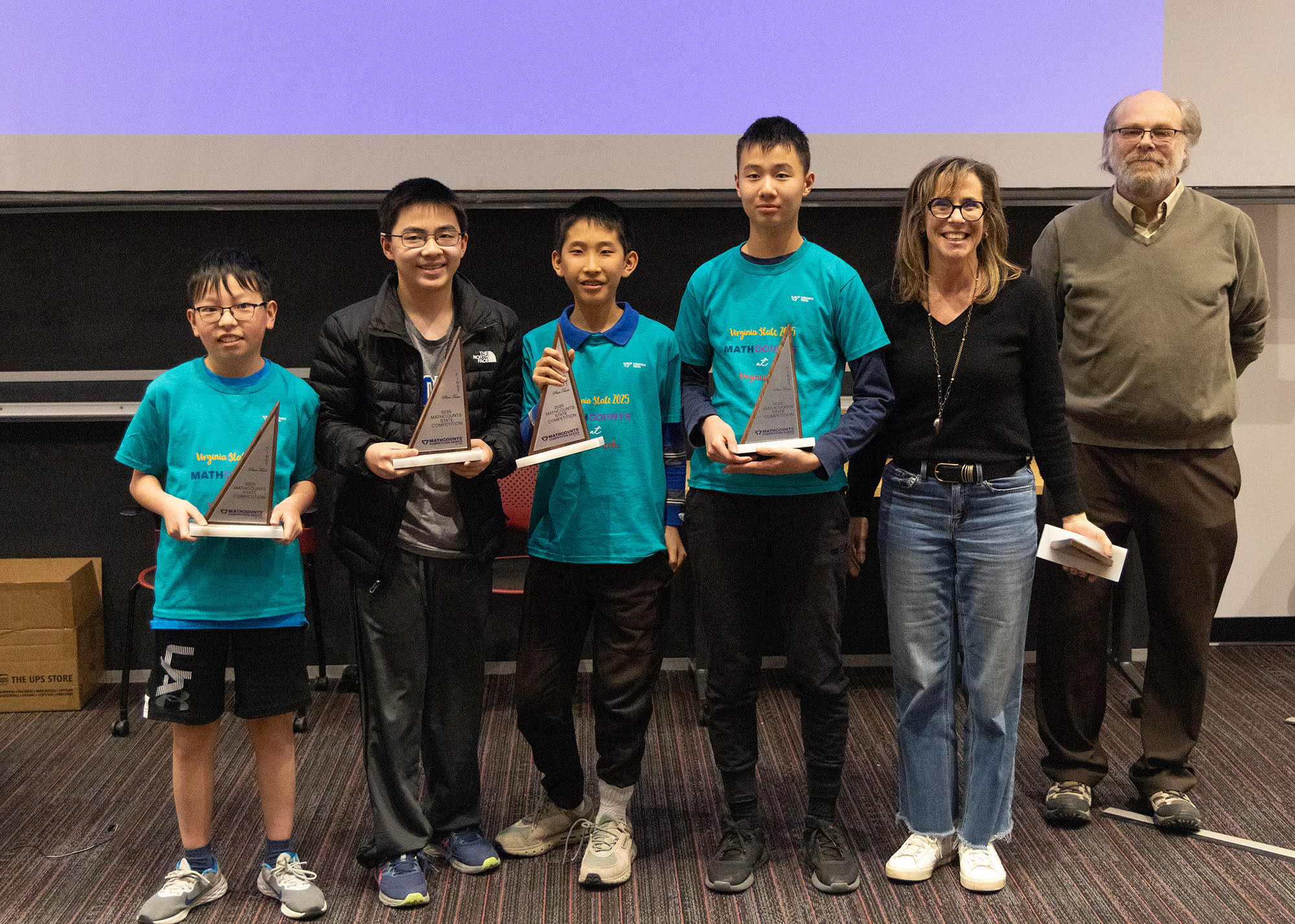 Math Counts Team Picture of four team members and coach from Cooper Middle School, along with Michel Plemling